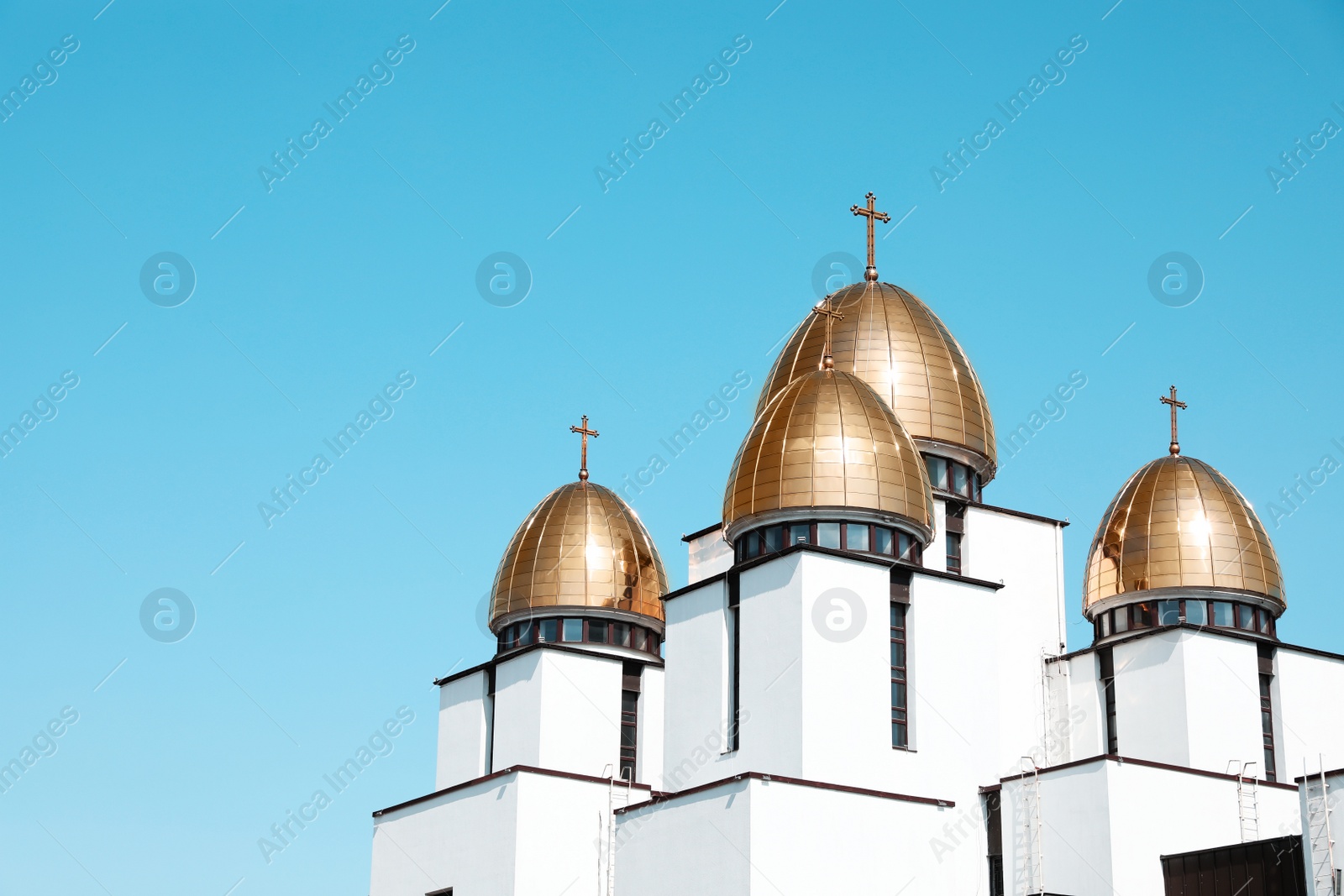 Photo of Lviv, Ukraine - May 1, 2022: Nativity of Holy Virgin Church against blue sky. Space for text