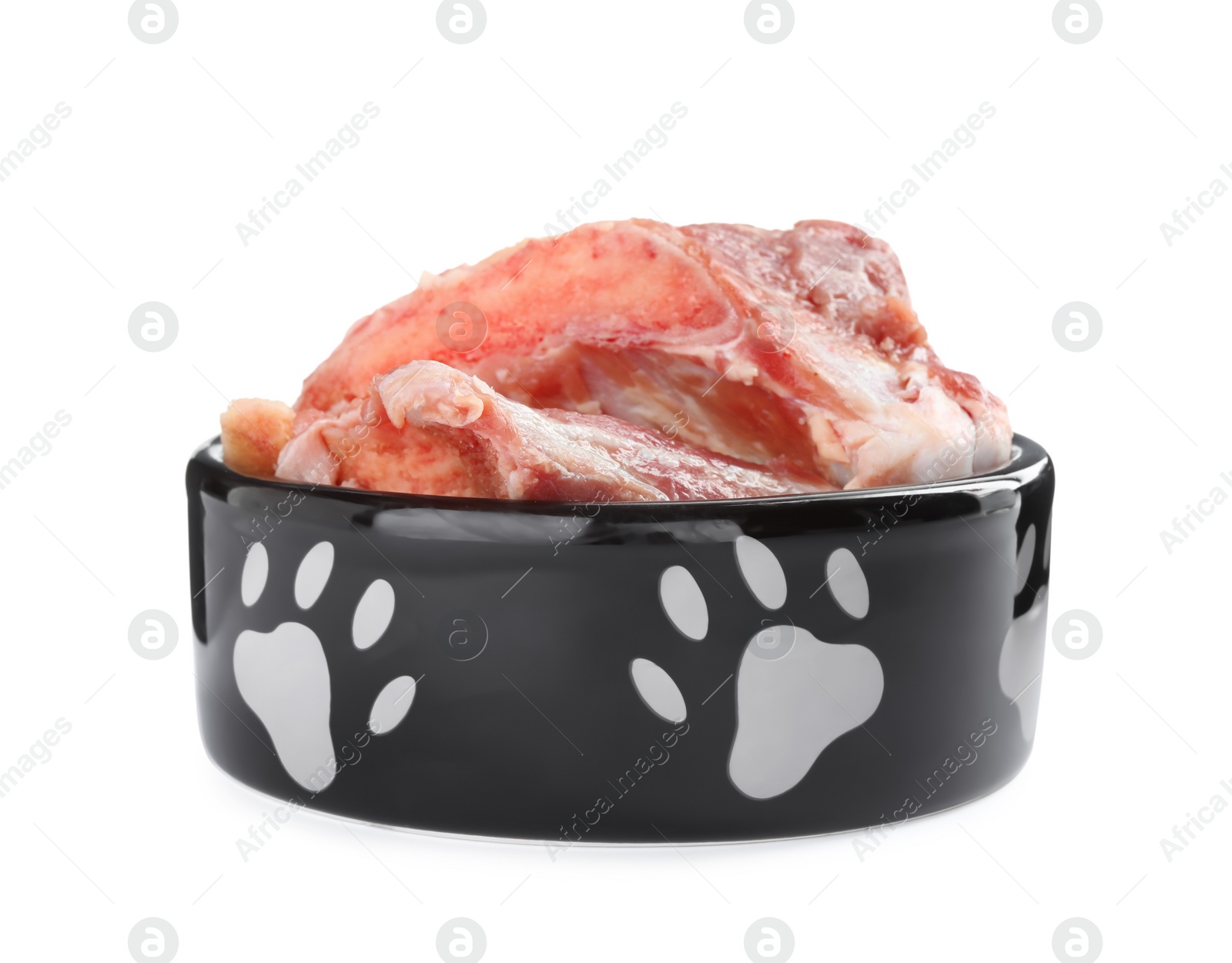 Photo of Feeding bowl with raw meaty bones isolated on white. Natural animal food