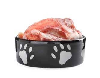 Feeding bowl with raw meaty bones isolated on white. Natural animal food