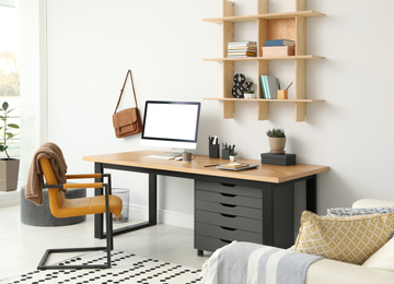 Photo of Stylish room interior with modern comfortable workplace