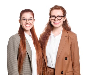 Photo of Portrait of beautiful young redhead sisters on white background