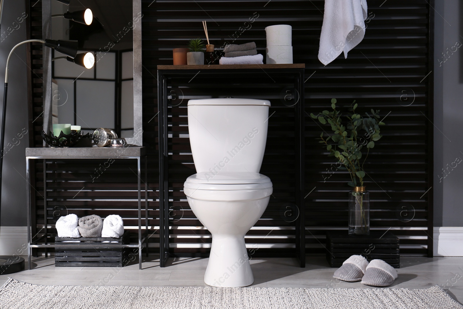 Photo of Stylish bathroom interior with toilet bowl and other essentials