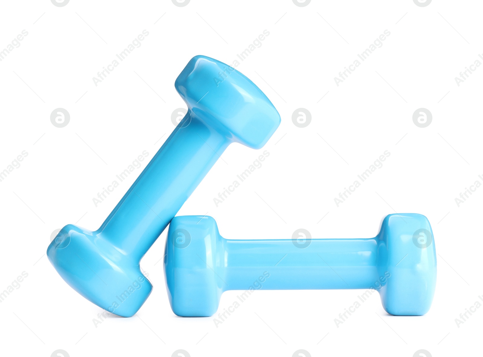 Photo of Light blue dumbbells isolated on white. Sports equipment