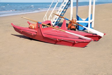 Photo of Rescue boat near watch tower on beach