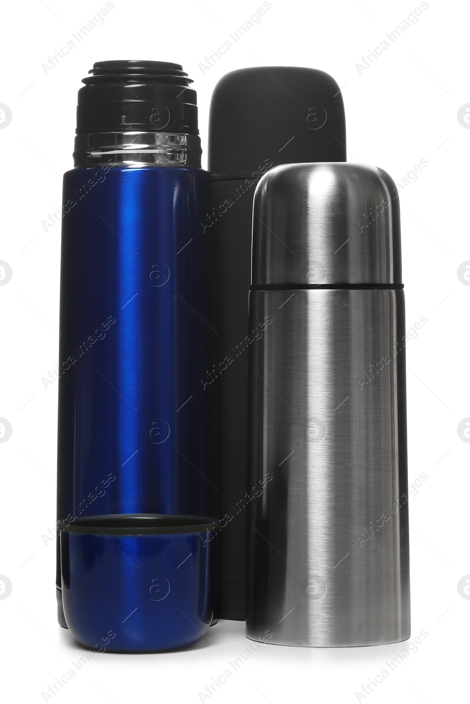 Photo of Stylish stainless thermo bottles isolated on white