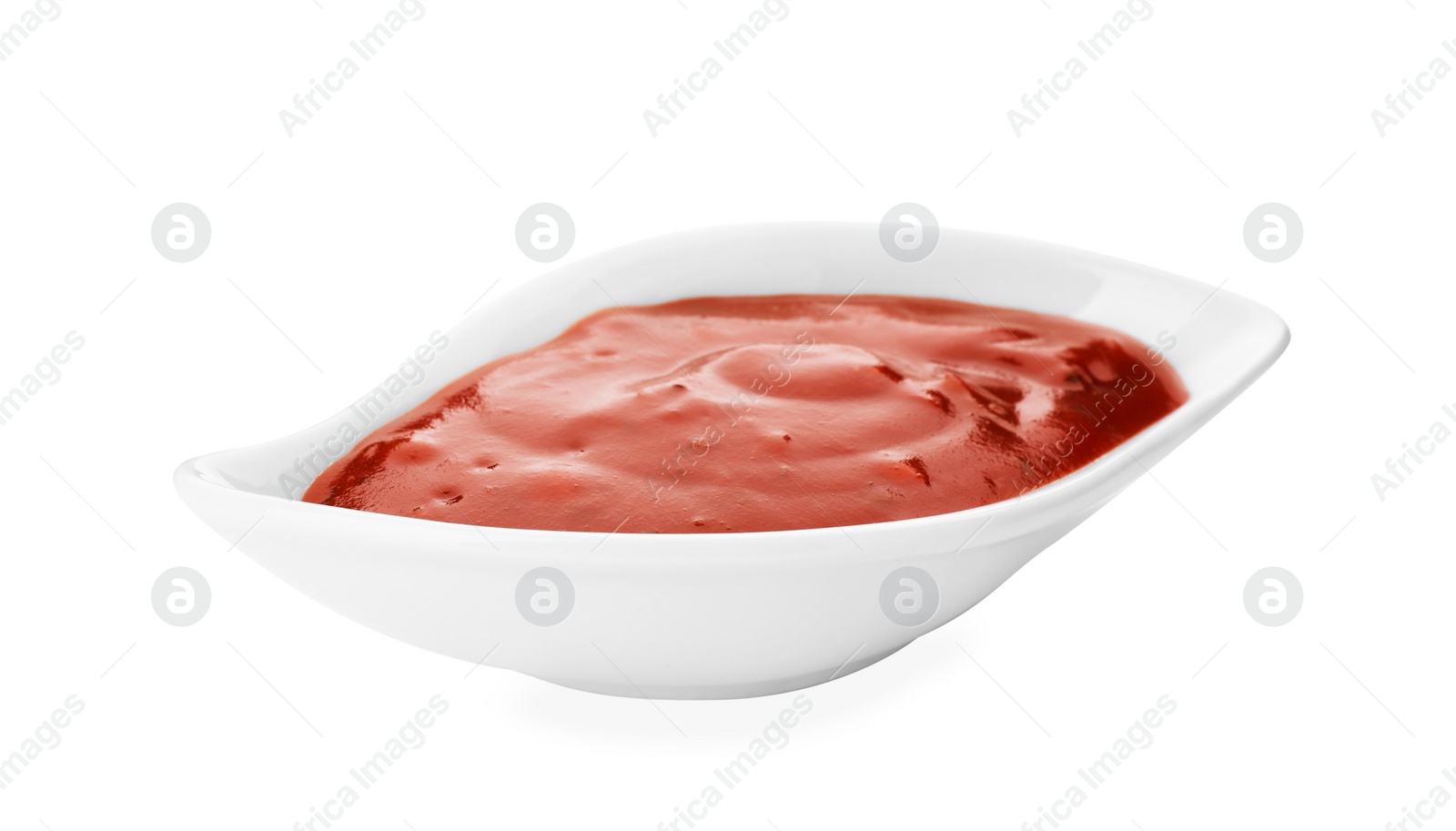 Photo of Gravy boat with spicy chili sauce on white background