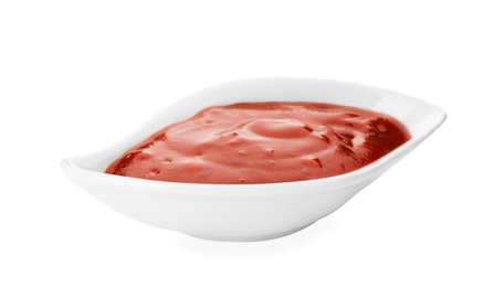 Photo of Gravy boat with spicy chili sauce on white background