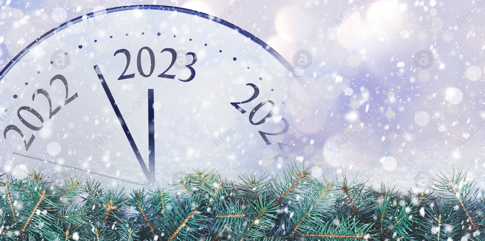Image of Clock counting last moments to New 2023 Year and beautiful fir branches, banner design. Bokeh effect