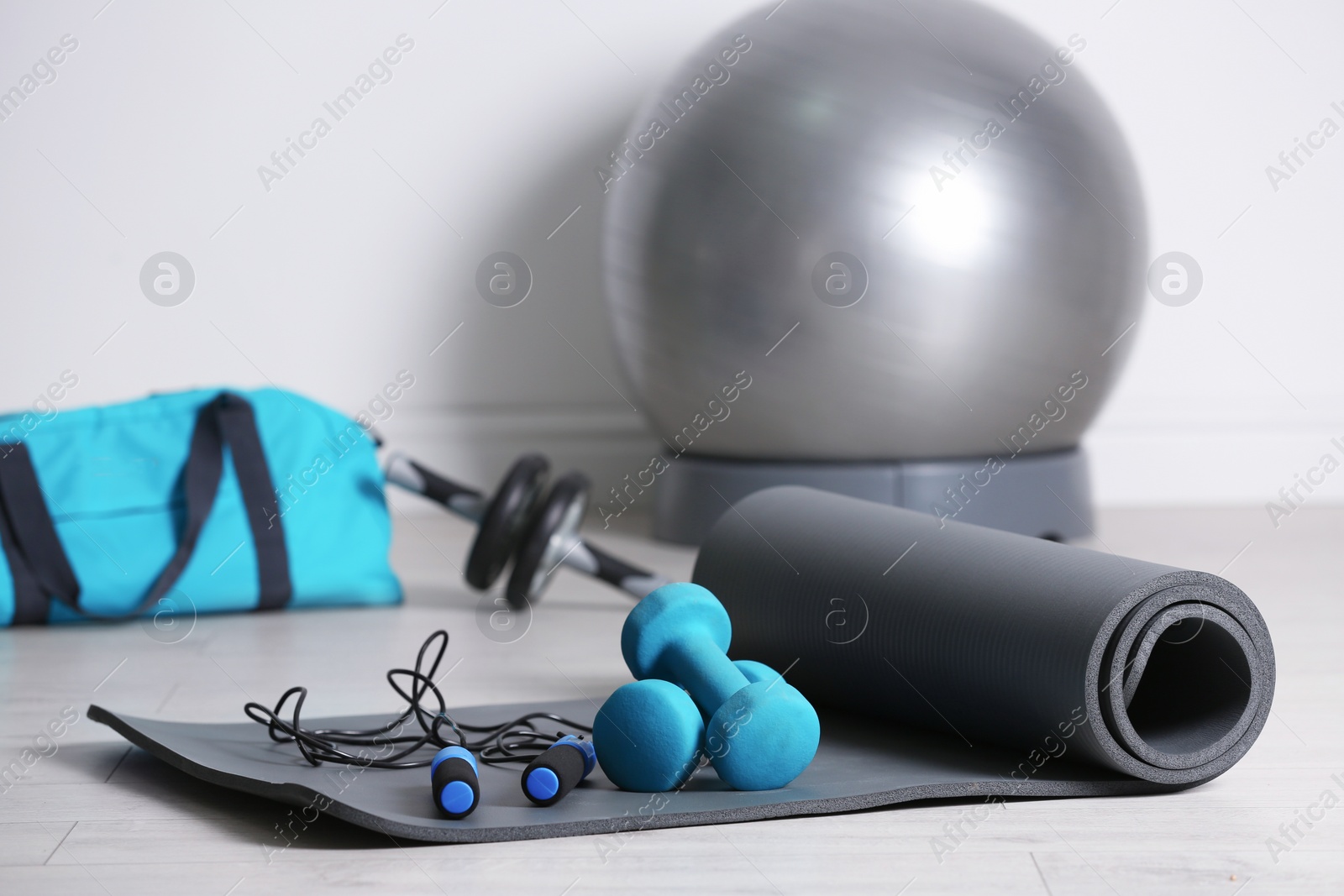 Photo of Set of fitness equipment on floor indoors