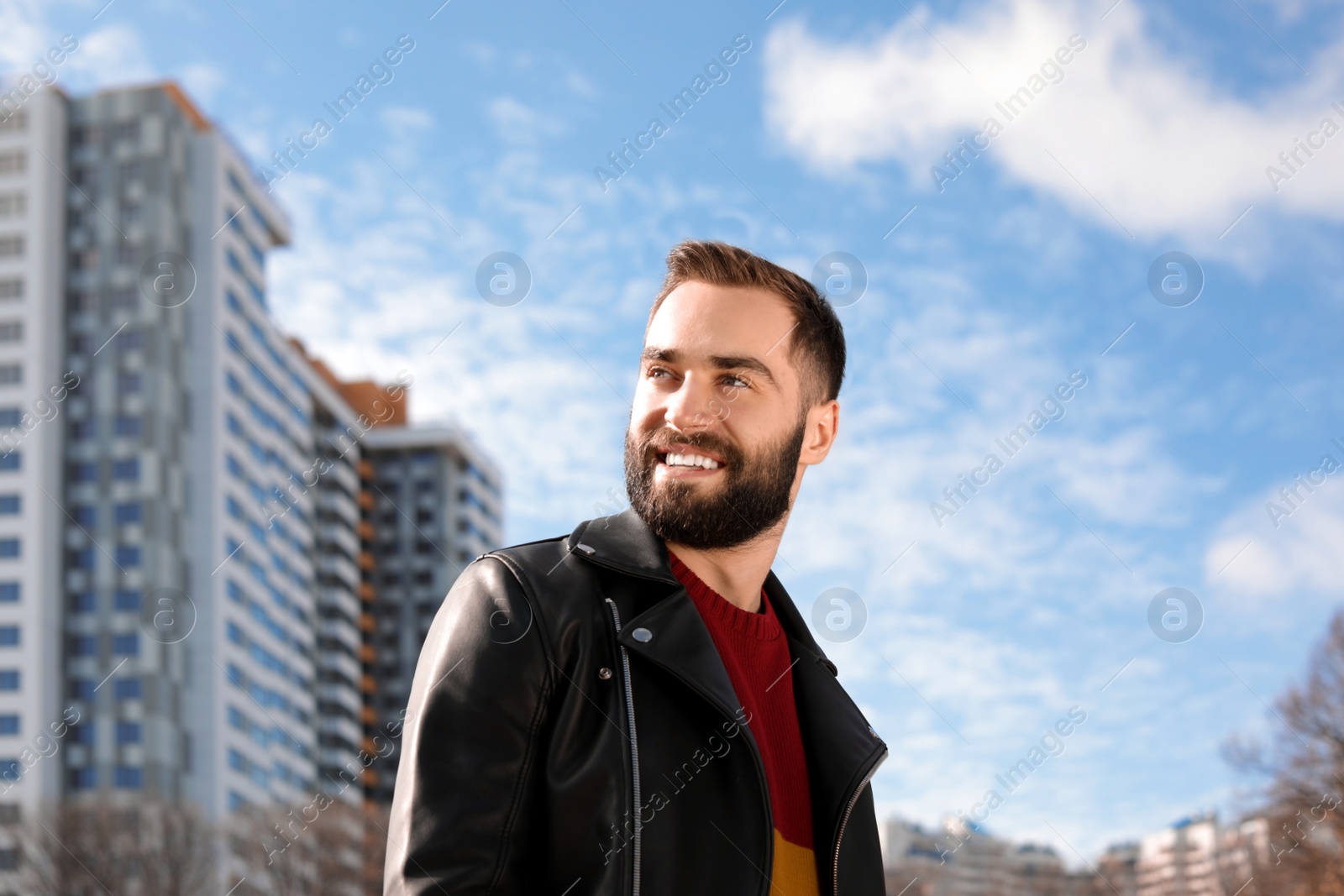Photo of Portrait of stylish young man on city street