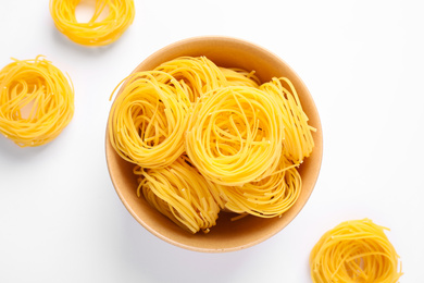 Photo of Angel hair pasta on white background, top view
