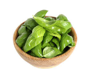 Photo of Fresh green basil leaves in wooden bowl isolated on white