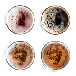 Set with glasses of cold tasty beer on white background, top view