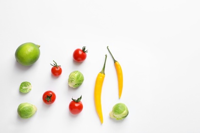 Photo of Fresh vegetables and fruit on white background, top view