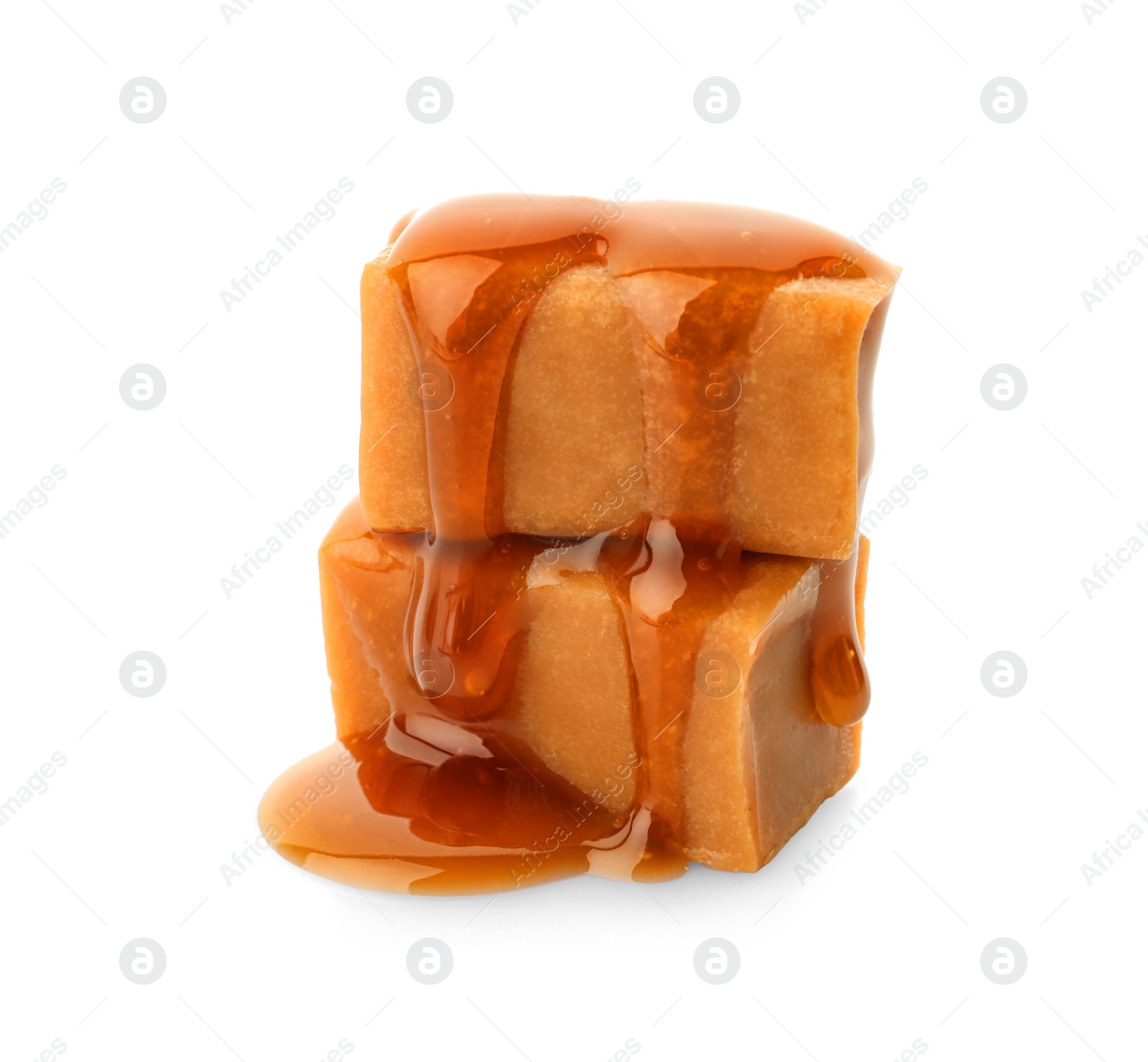 Photo of Delicious candies with caramel sauce on white background