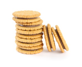 Photo of Tasty sandwich cookies with chocolate cream on white background