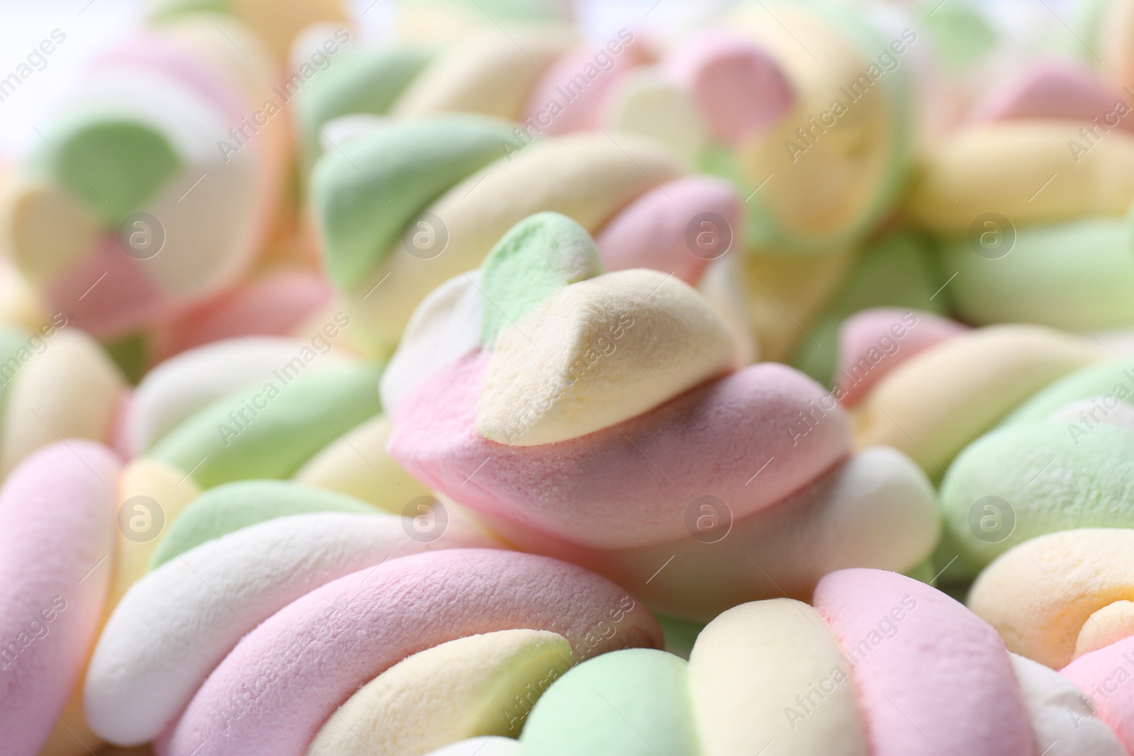 Photo of Delicious colorful marshmallows as background, closeup view