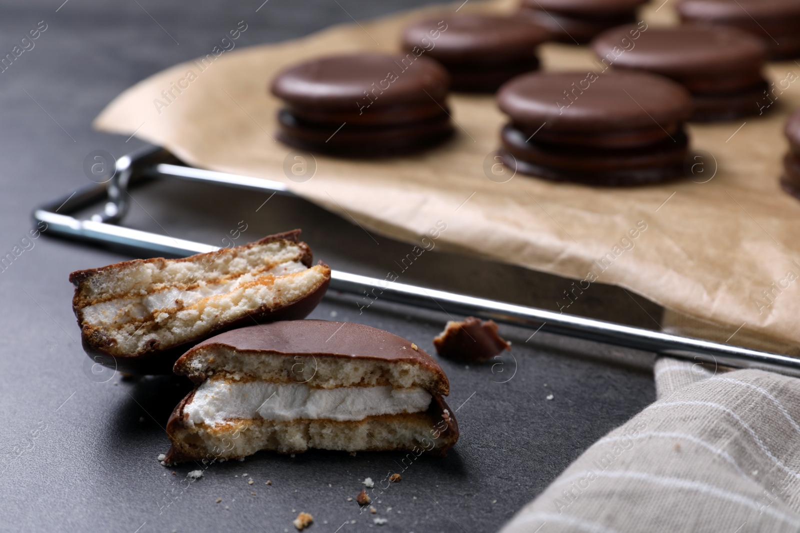 Photo of Tasty broken choco pie on grey table, closeup view