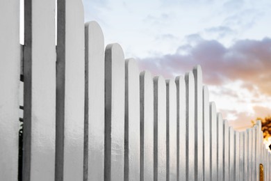 Photo of Beautiful white wooden fence against sky outdoors