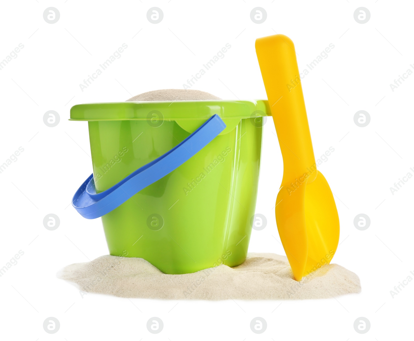 Photo of Plastic beach toys on pile of sand against white background