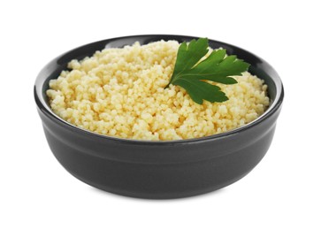 Tasty couscous with parsley on white background