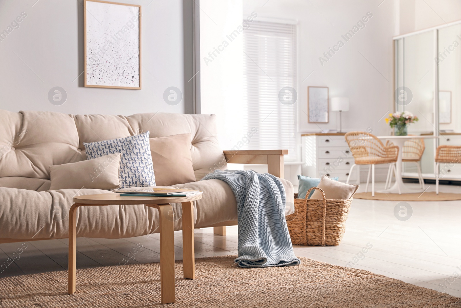Photo of Spacious apartment interior with wooden table and comfortable sofa