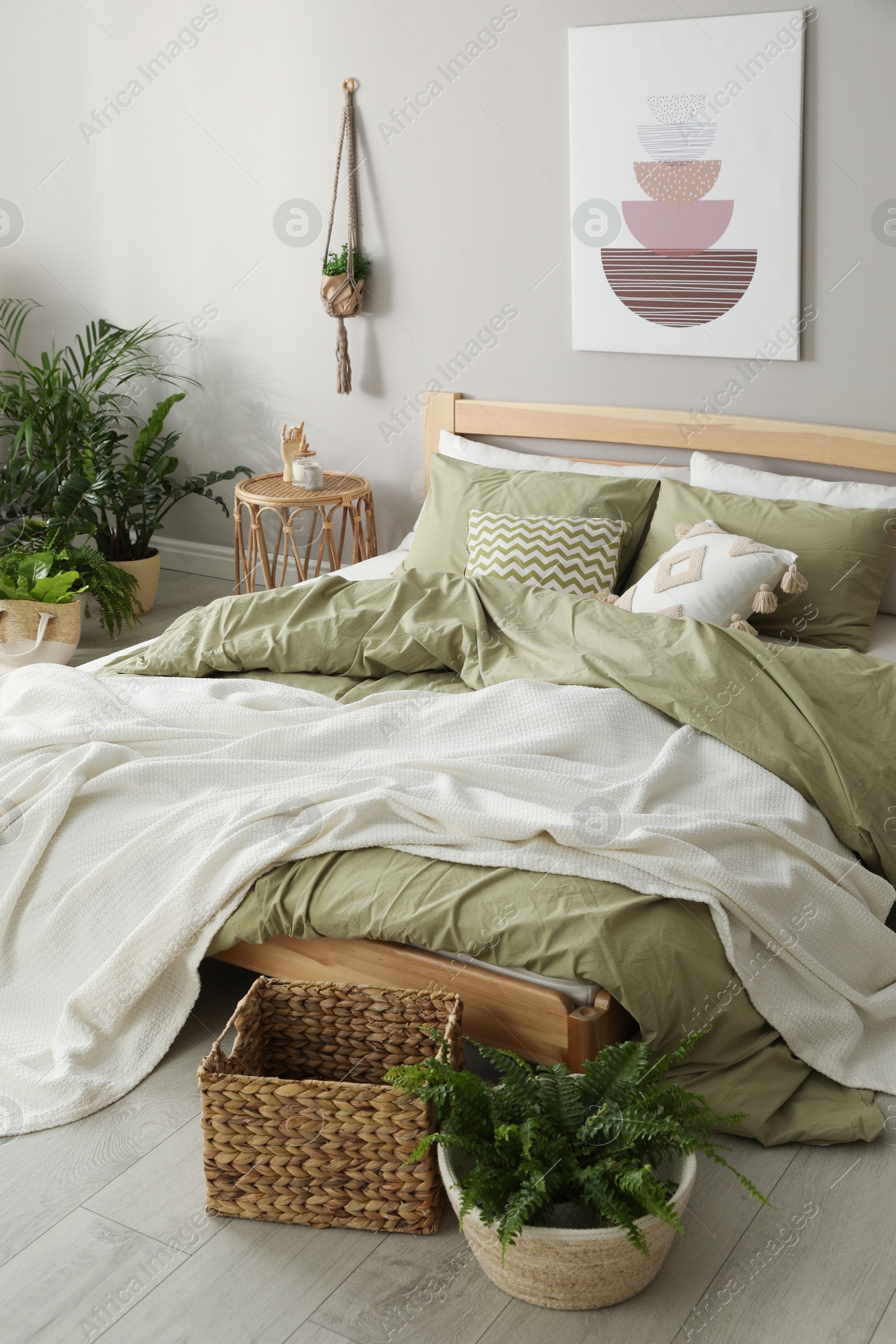 Photo of Comfortable wooden bed in room. Stylish interior