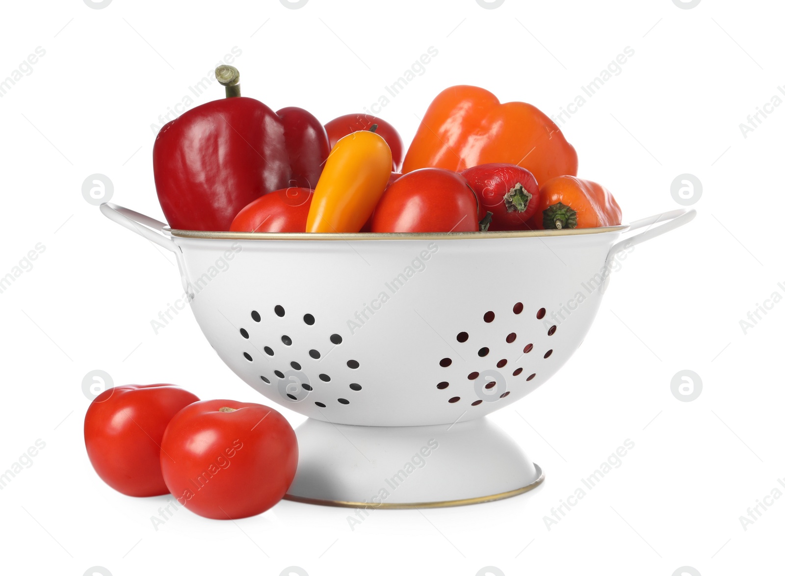 Photo of Colander with fresh vegetables isolated on white