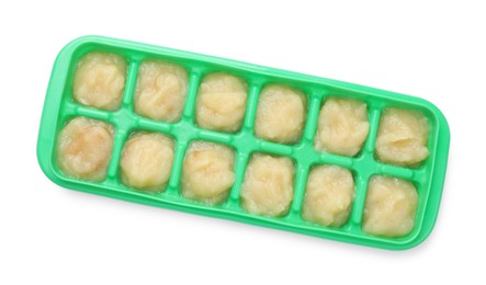 Photo of Apple puree in ice cube tray isolated on white, top view. Ready for freezing