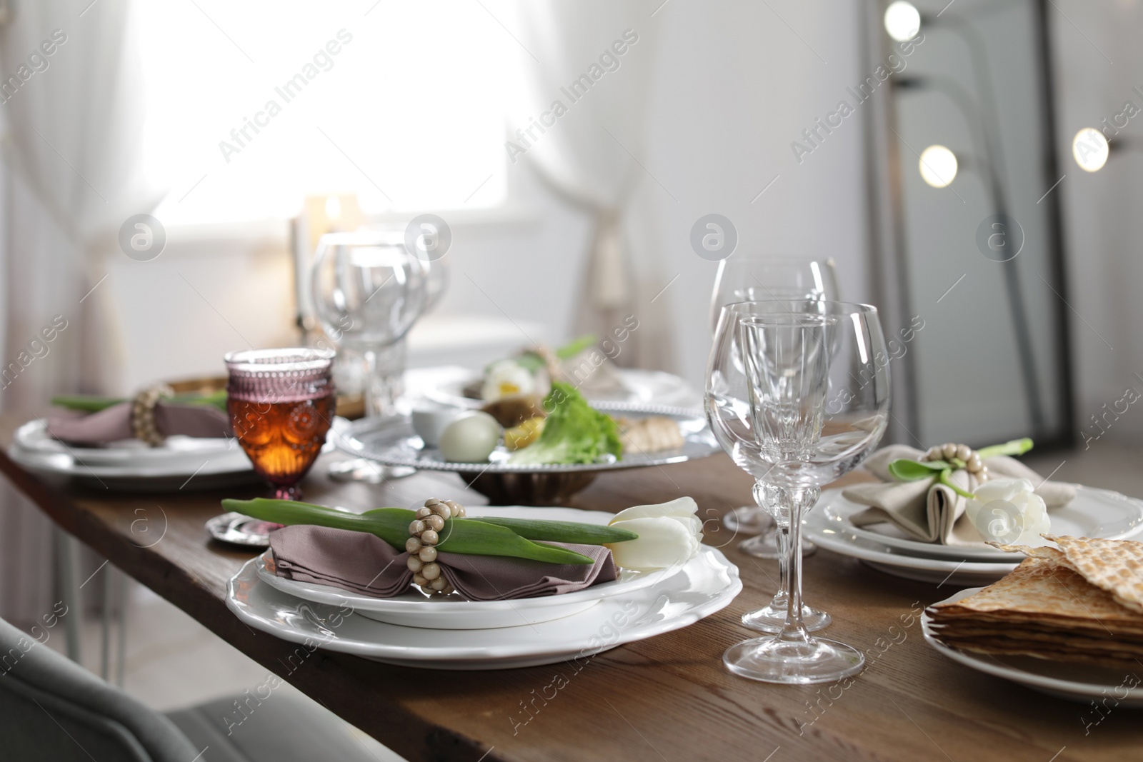 Photo of Festive Passover table setting at home. Pesach celebration