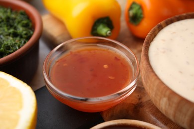 Photo of Fresh marinades and ingredients on table, closeup