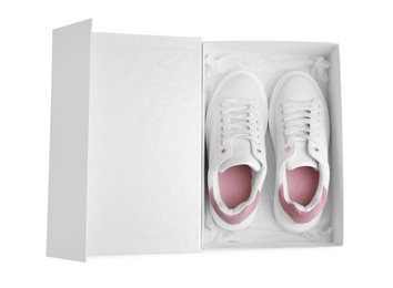 Photo of Pair of stylish sport shoes in box on white background, top view