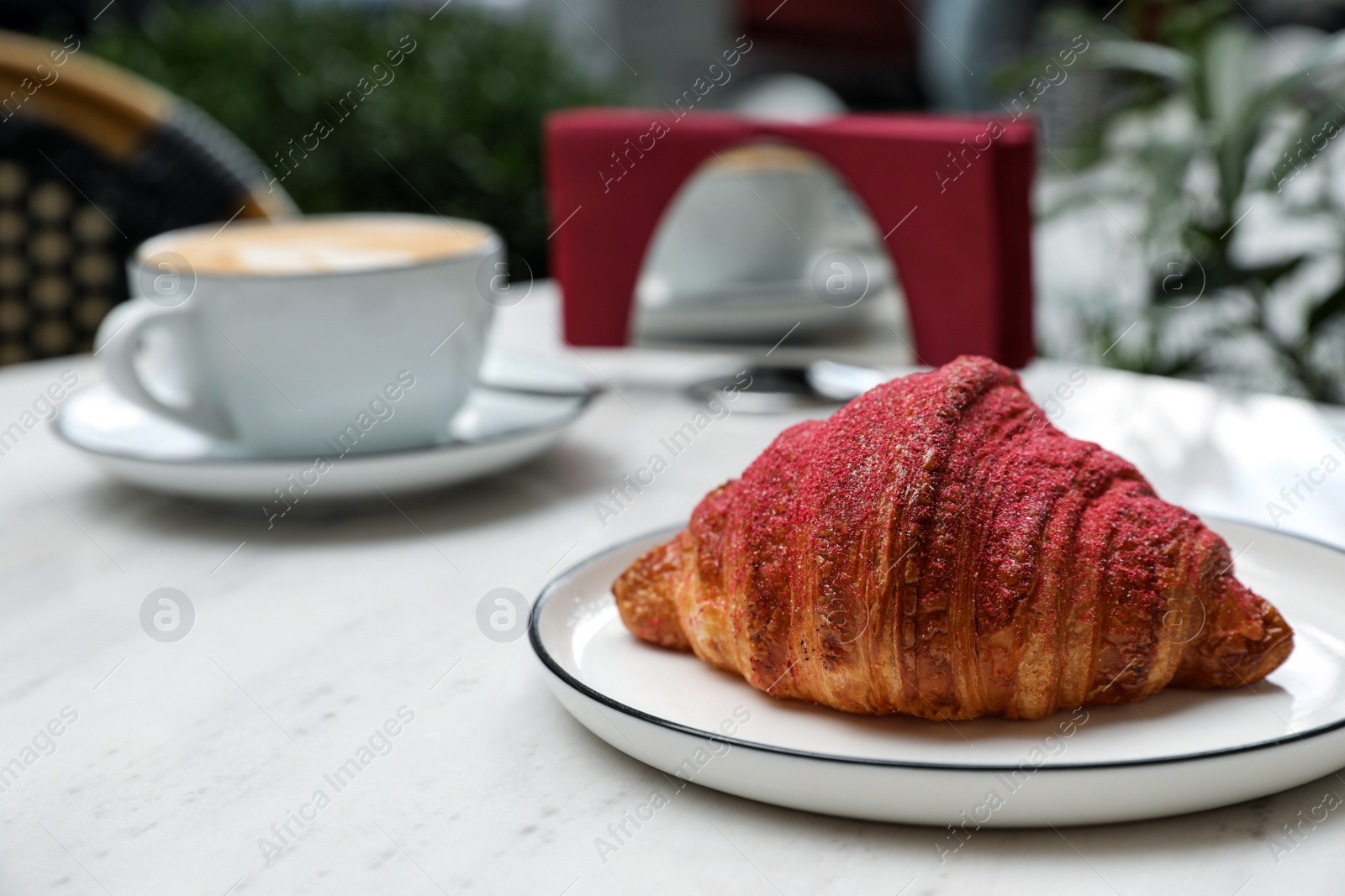 Photo of Delicious croissant and coffee on white marble table