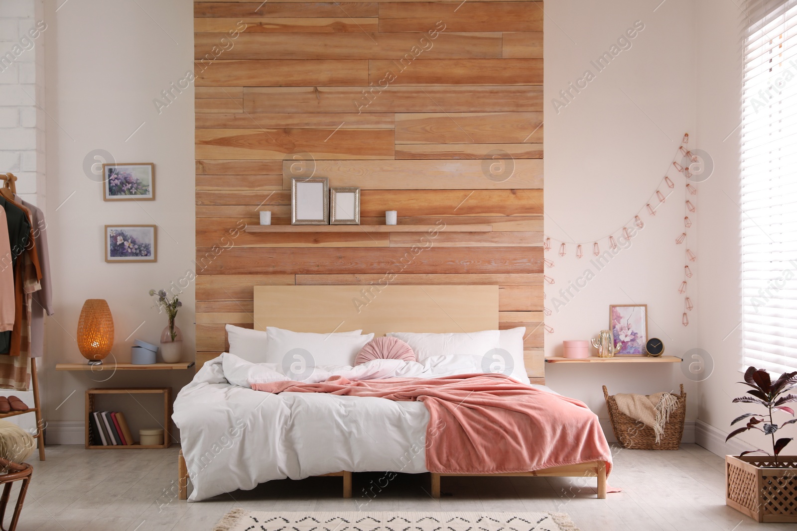 Photo of Stylish room interior with big comfortable bed