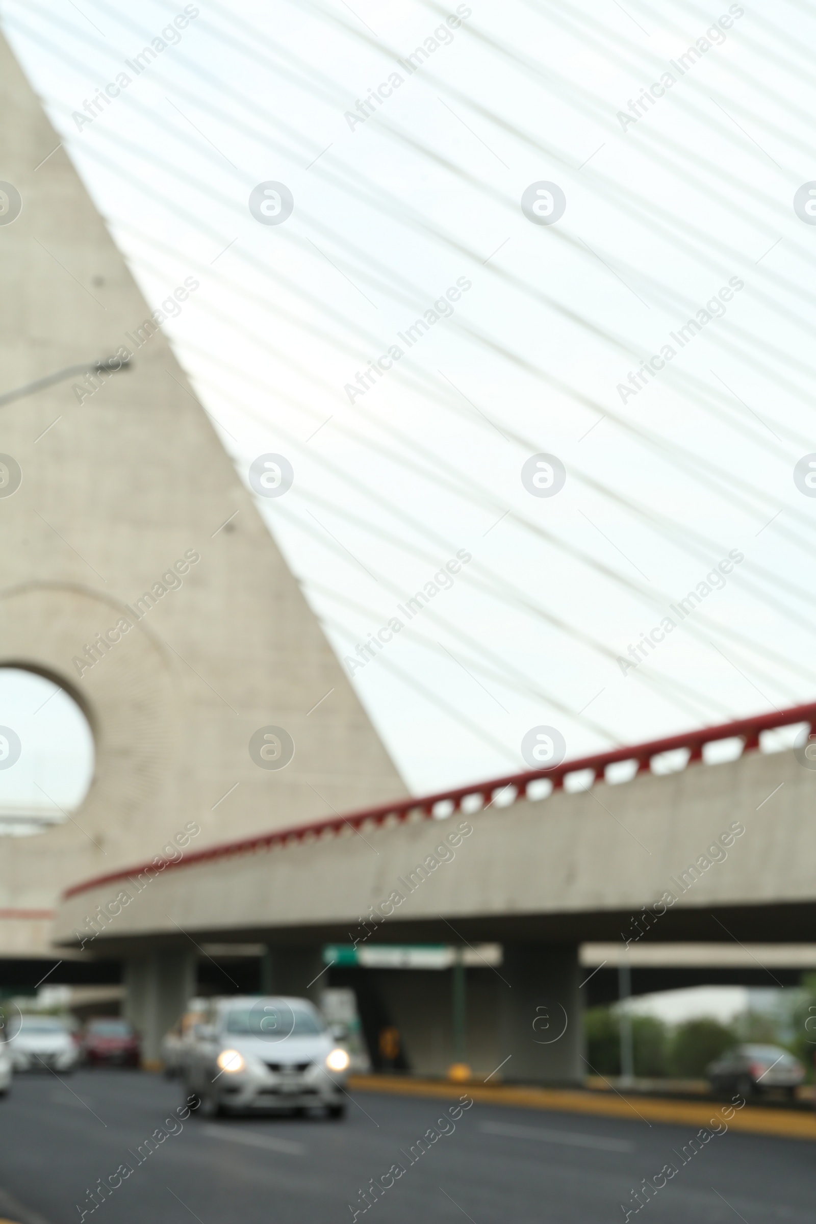 Photo of Blurred view of cars on modern bridge