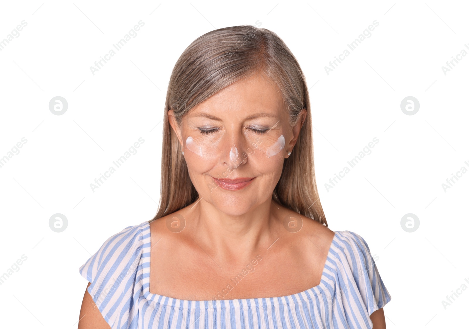 Photo of Beautiful senior woman with sun protection cream on her face isolated on white