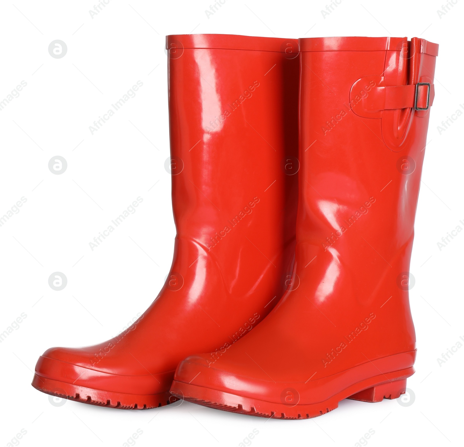 Photo of Modern red rubber boots isolated on white