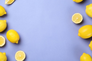 Flat lay composition with whole and sliced lemons on color background