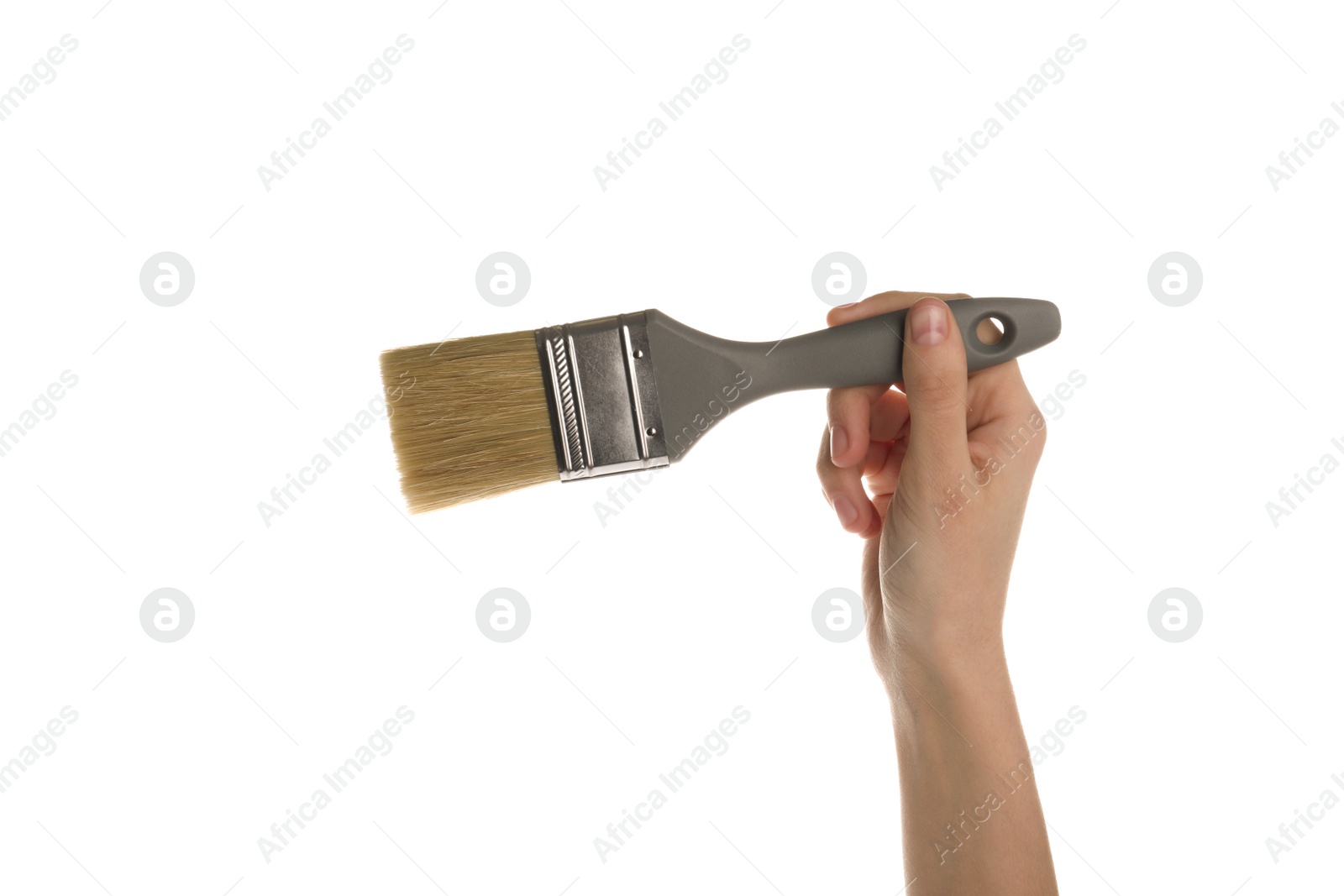 Photo of Woman holding paint brush on white background, closeup