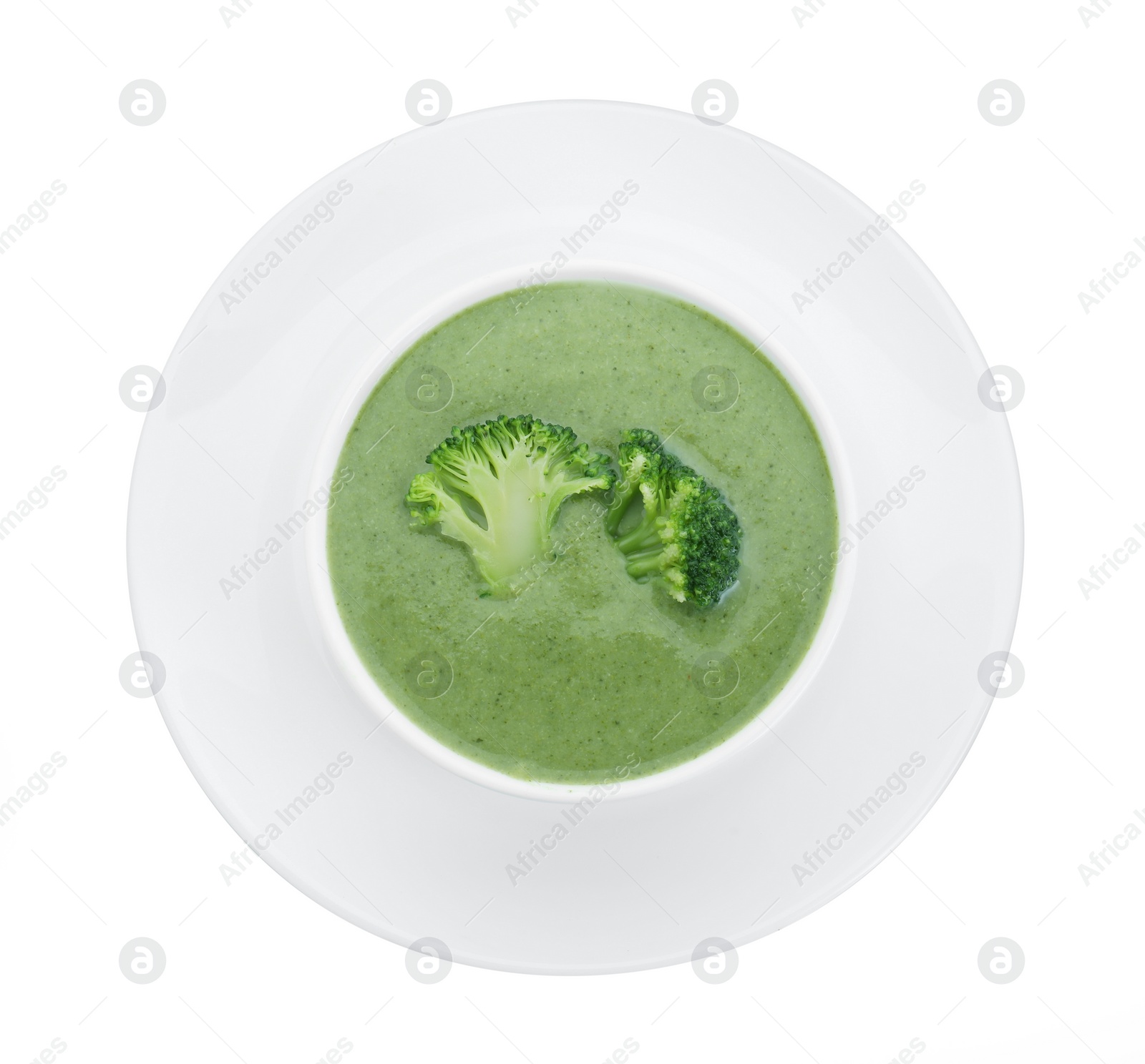 Photo of Delicious broccoli cream soup in bowl isolated on white, top view