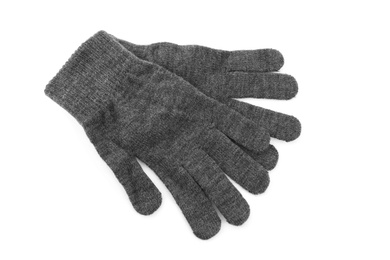 Photo of Grey woolen gloves on white background, top view. Winter clothes