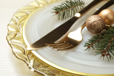Photo of Beautiful Christmas table setting on white wooden background, closeup