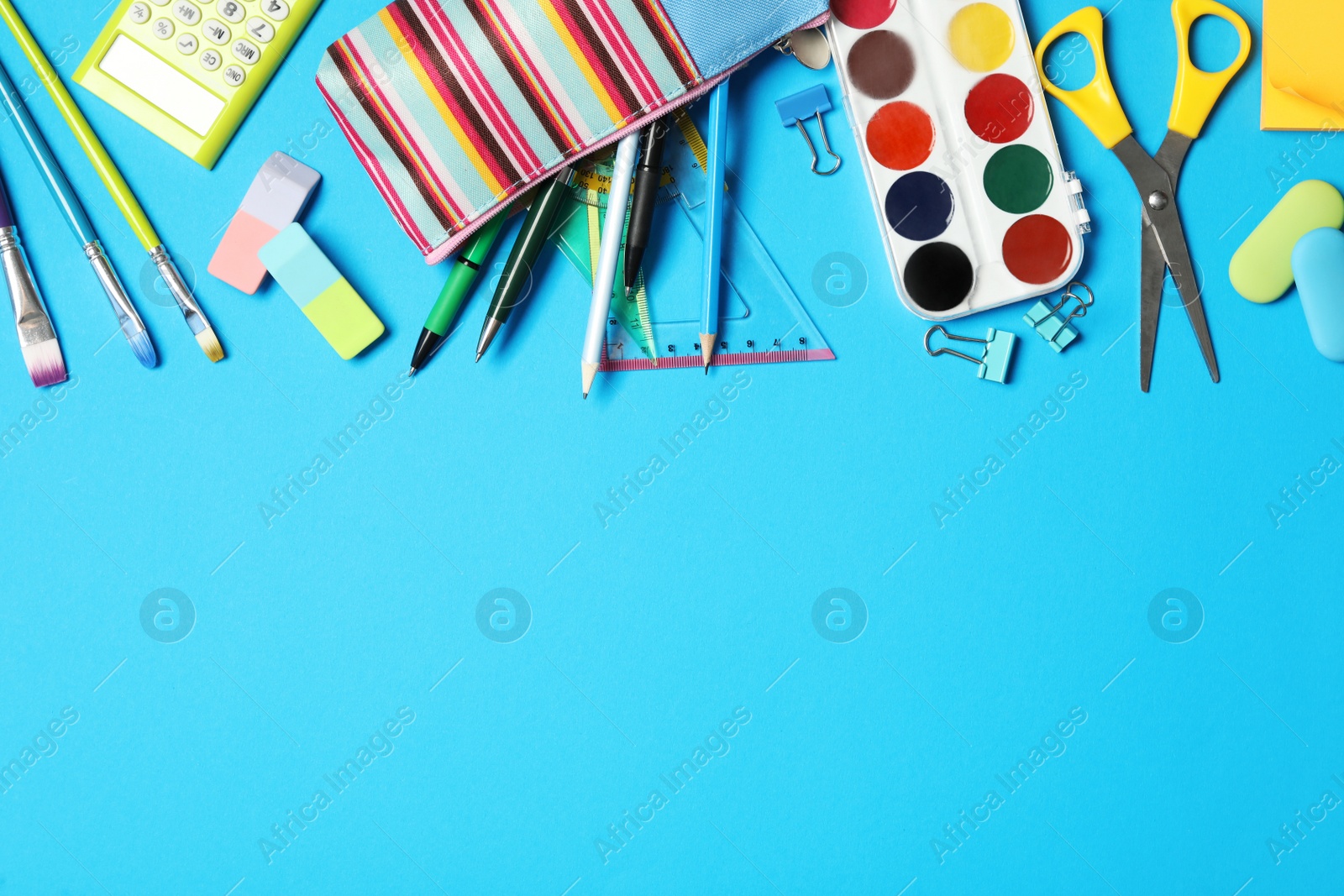 Photo of Different stationery on light blue background, flat lay with space for text. Back to school