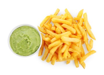 Pile of french fries and dish with avocado dip on white background, top view