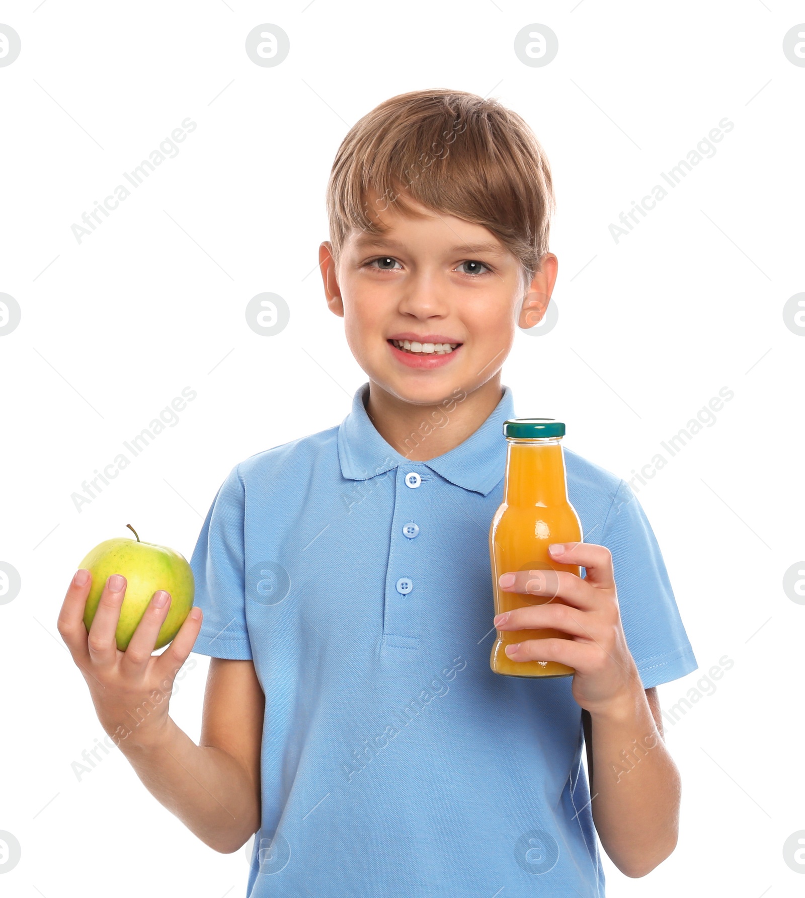 Photo of Little boy with bottle of juice and apple on white background. Healthy food for school lunch