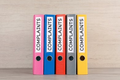 Image of Colorful folders with Complaints labels on table