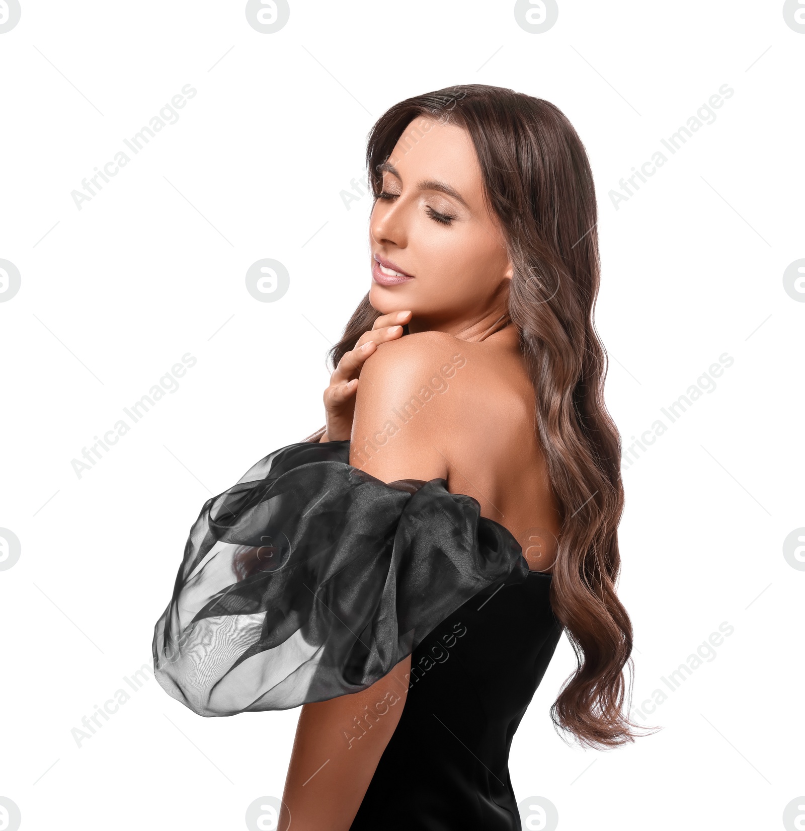 Photo of Hair styling. Beautiful woman with wavy long hair on white background