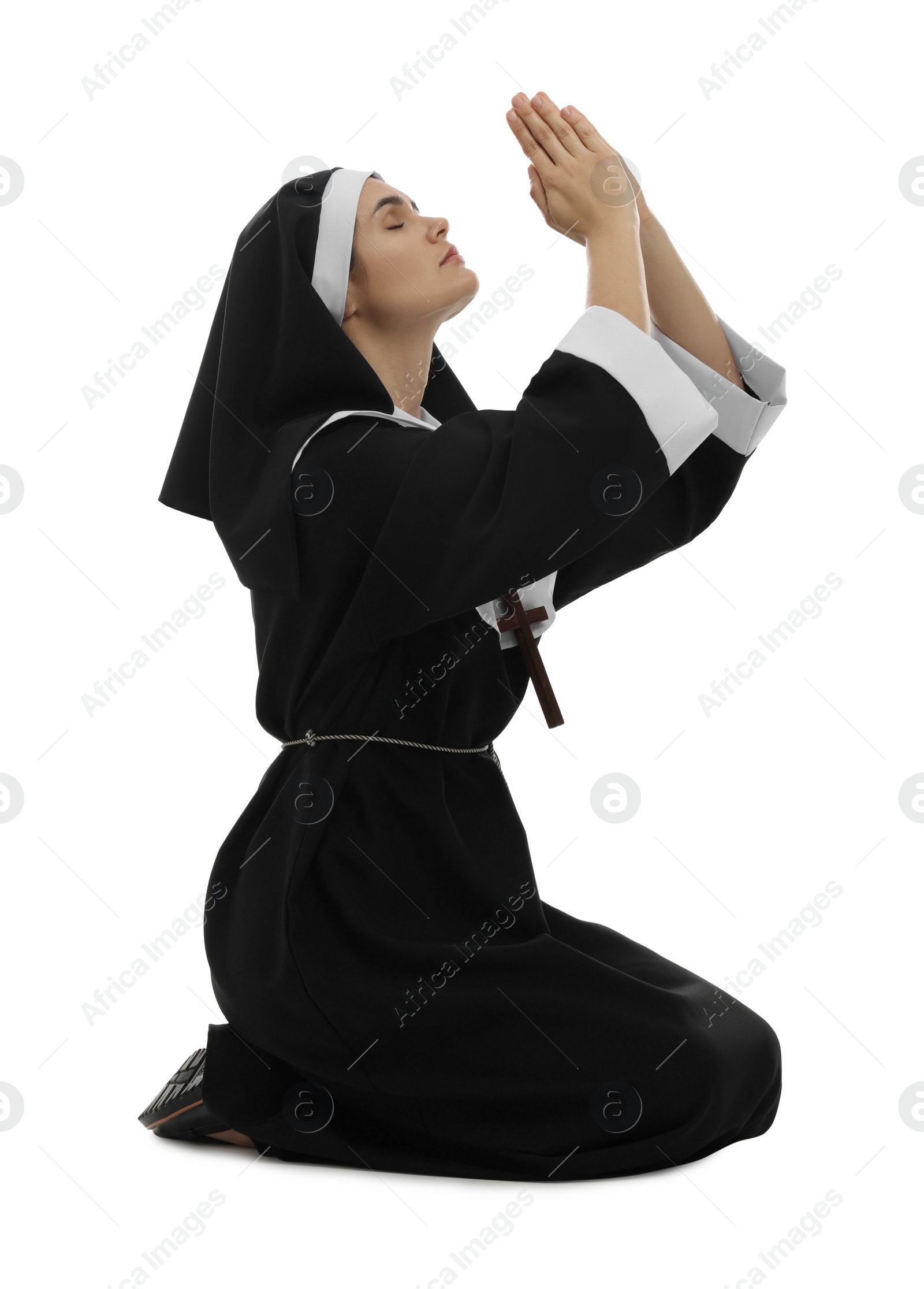 Photo of Nun with clasped hands praying to God on white background