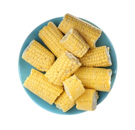 Plate with pieces of corncobs on white background, top view