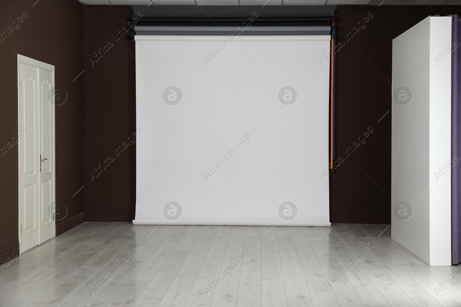 Photo of Empty white photo background. Professional studio equipment